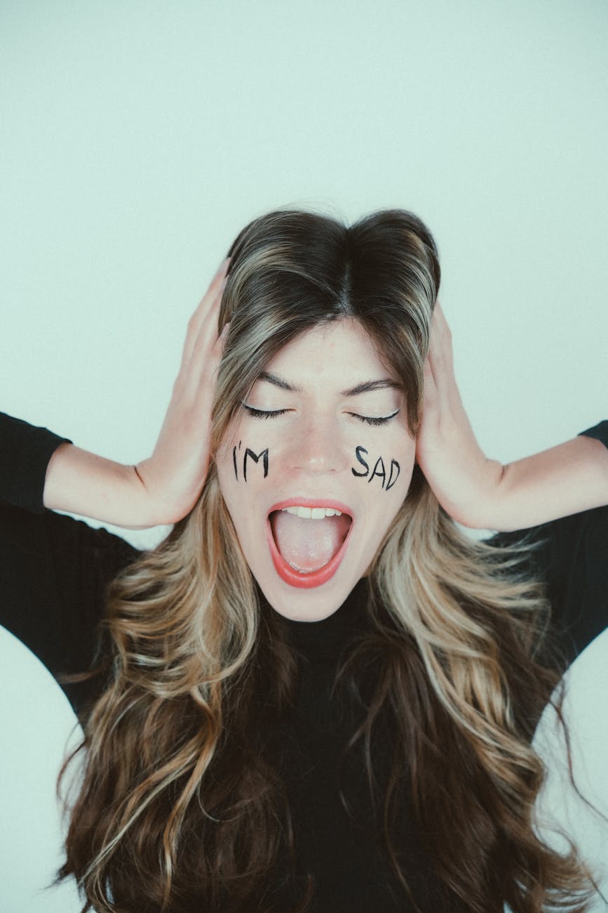 emotional woman expressing sadness with facial words